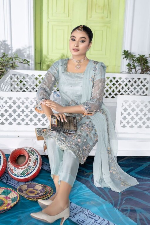 A beautiful silver hue illustrating the small floral pattern is all over! This 3-piece bridal suit of sequin, Tilla, patchy, and hand-embellished work is a very graceful dress. The suit is one of the best Pakistani bridal dresses for walima, and it has a tarkash back, tarkash front, and tarkash sleeves as well. The dress has no doubt sequin silver work, but the peachy pink floral patterns and darker shades of big florals look very enticing. Moreover, the plain grip style trouser in silk fabric exudes grace. And the chiffon fabric dupatta of this pretty mint ensemble also looks very intriguing, matching the style of the dress as well. Heavy Embroidered Sequins Tarkash Front with Hand work Kora & Dabka work